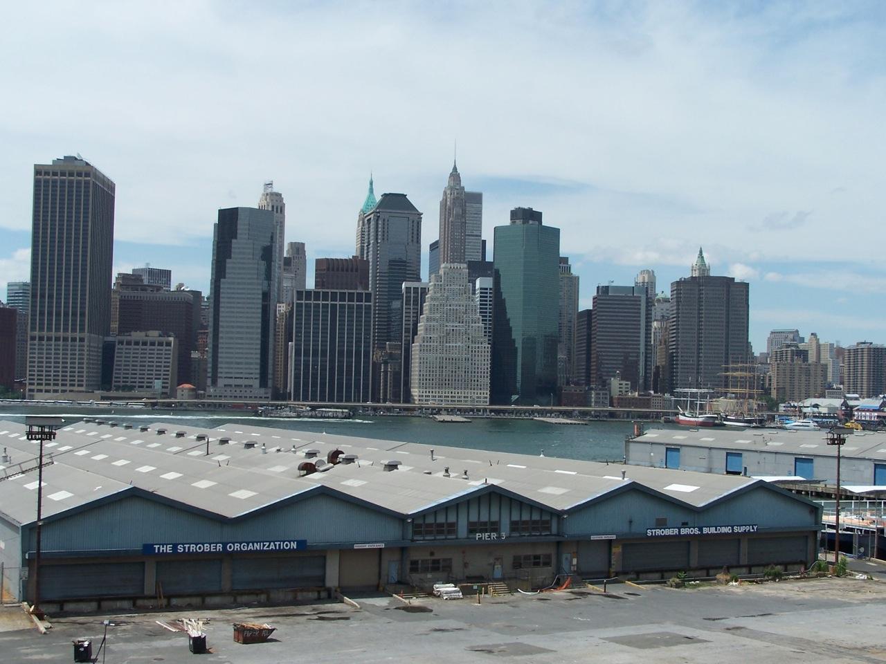 View of the piers prior to park construction with lower Manhattan in the background.