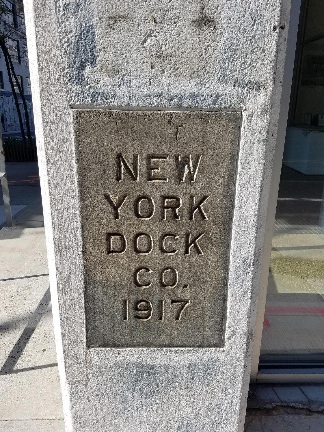 Concrete post with plaque that says "New York Dock co. 1917"