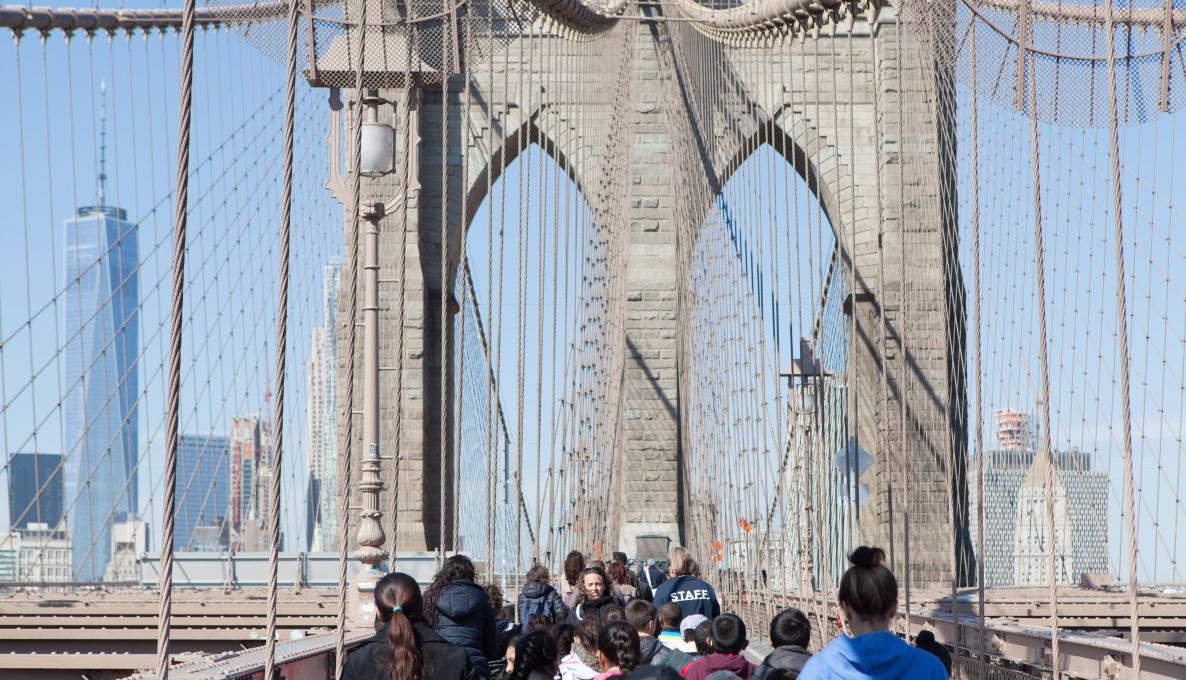 Group walking on Brooklyn Bridge