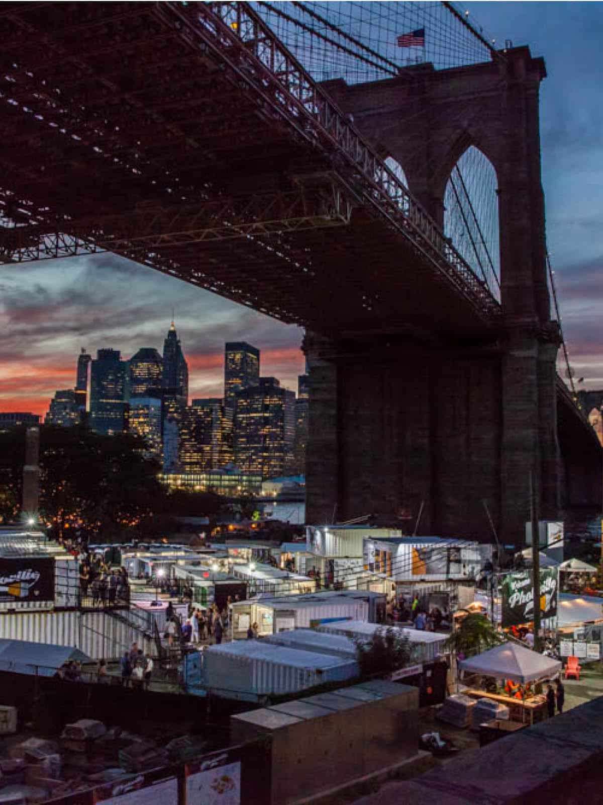 Aerial view of trailers in the Photoville exhibition in 2016 at night. Seen underneath the Brooklyn Bridge.
