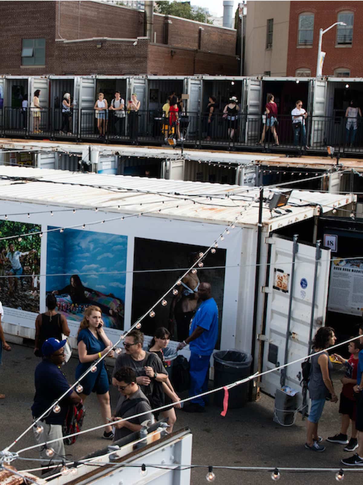 Overhead view of shipping containers displaying photos as a part of the Photoville exhibition.