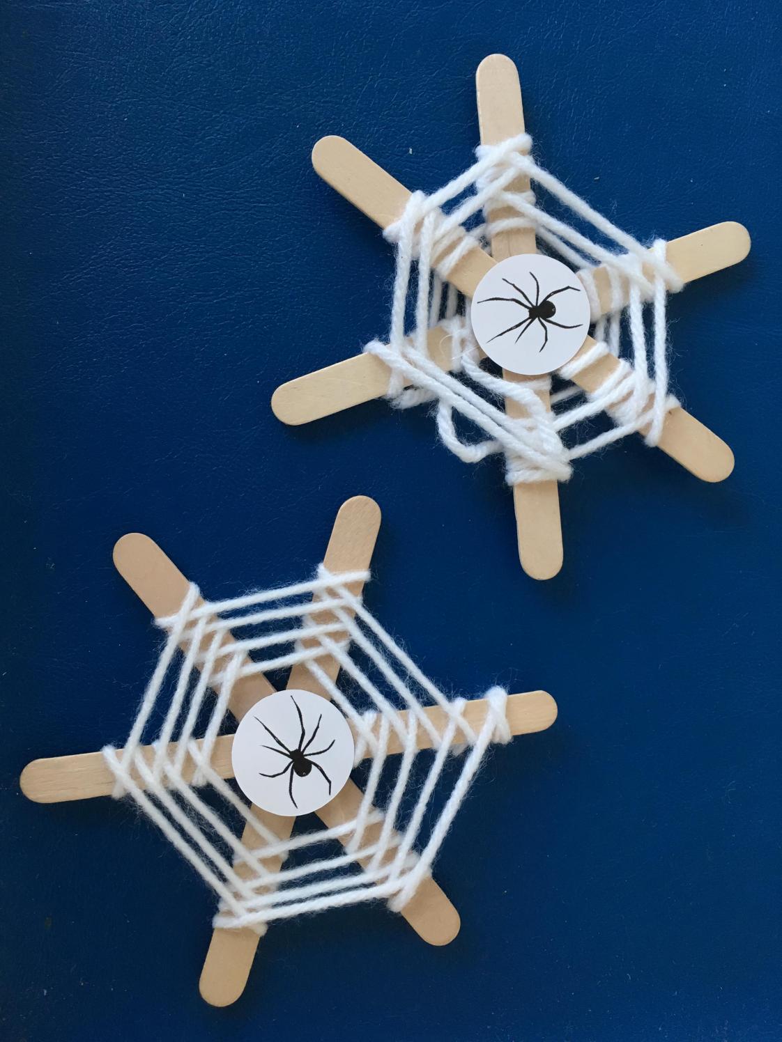 Spider web craft made with popsicle sticks
