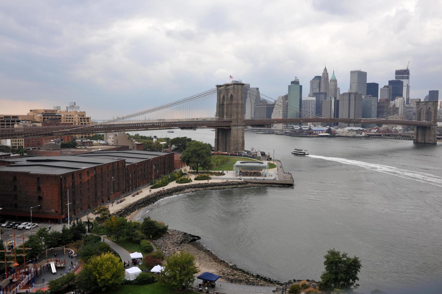 Aerial view of the Empire Stores and the Brooklyn Bridge on a cloudy day.